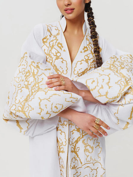 White kaftan with gold embroidery