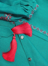 Turquoise kaftan with bright embroidery